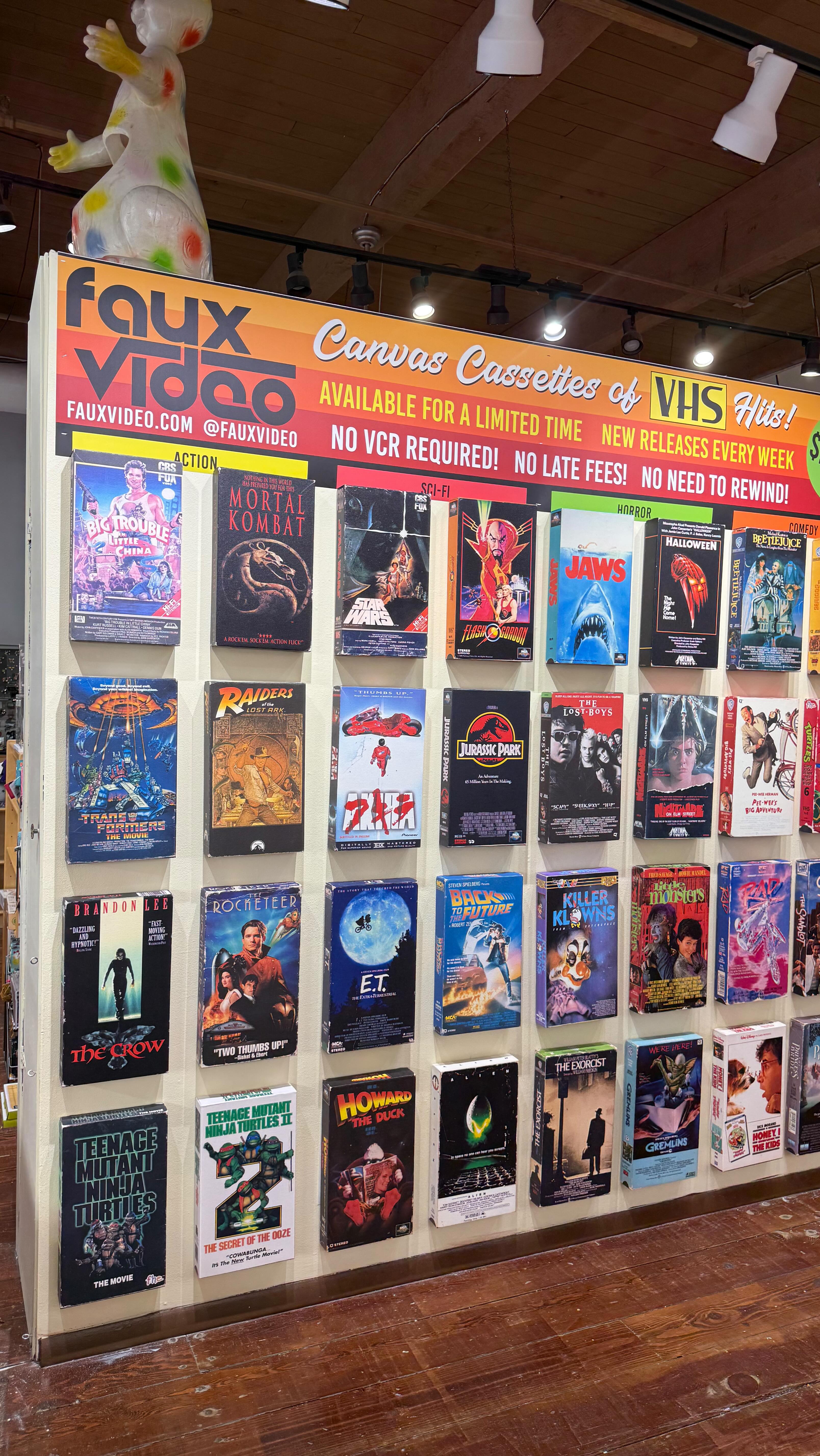 Experience the Power of VHS on display!
.
@fauxvideo has taken over the wall upstairs!
.
Canvas cassettes of VHS hits!
No VCR Required.
No late fees.
No need to rewind.
Available for a limited time!
🚧
#tatescomics #bearandbirdgallery @bearandbirdgallery